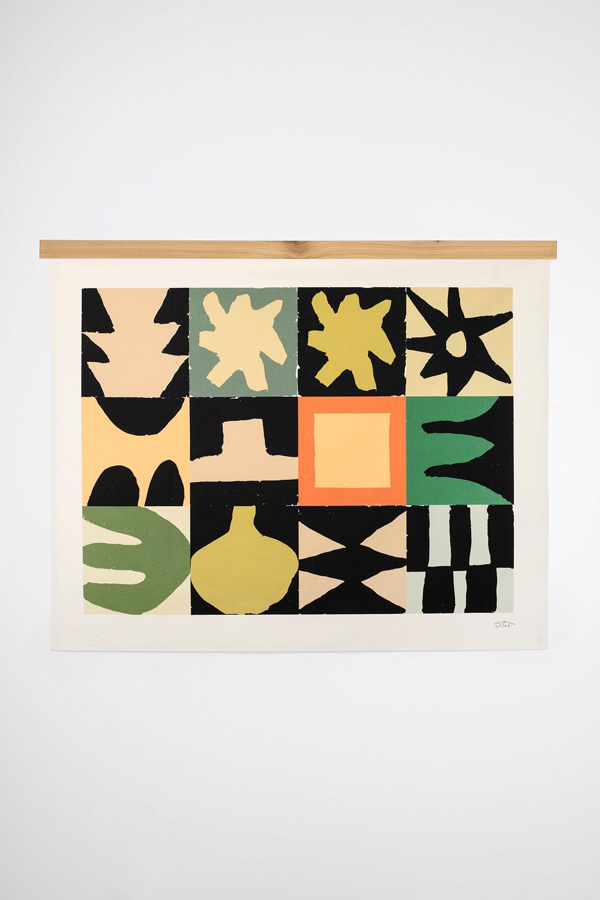 The Gozo is an original art print on 100% cotton canvas from Michael Upton. Featuring a geometric abstract mosaic design with bold colorful shapes, the Gozo is a large format modern wall hanging. Shown here with a wood hanging bar on a white background.
