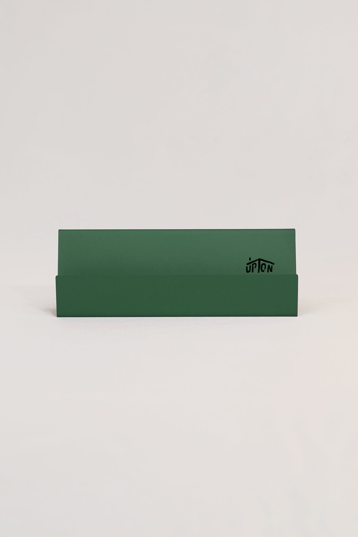 Upton Now Playing Stand in pine green. Modern and minimalist steel display stand made to hold the record sleeve for the album currently playing on the turntable. Shown on a white background.