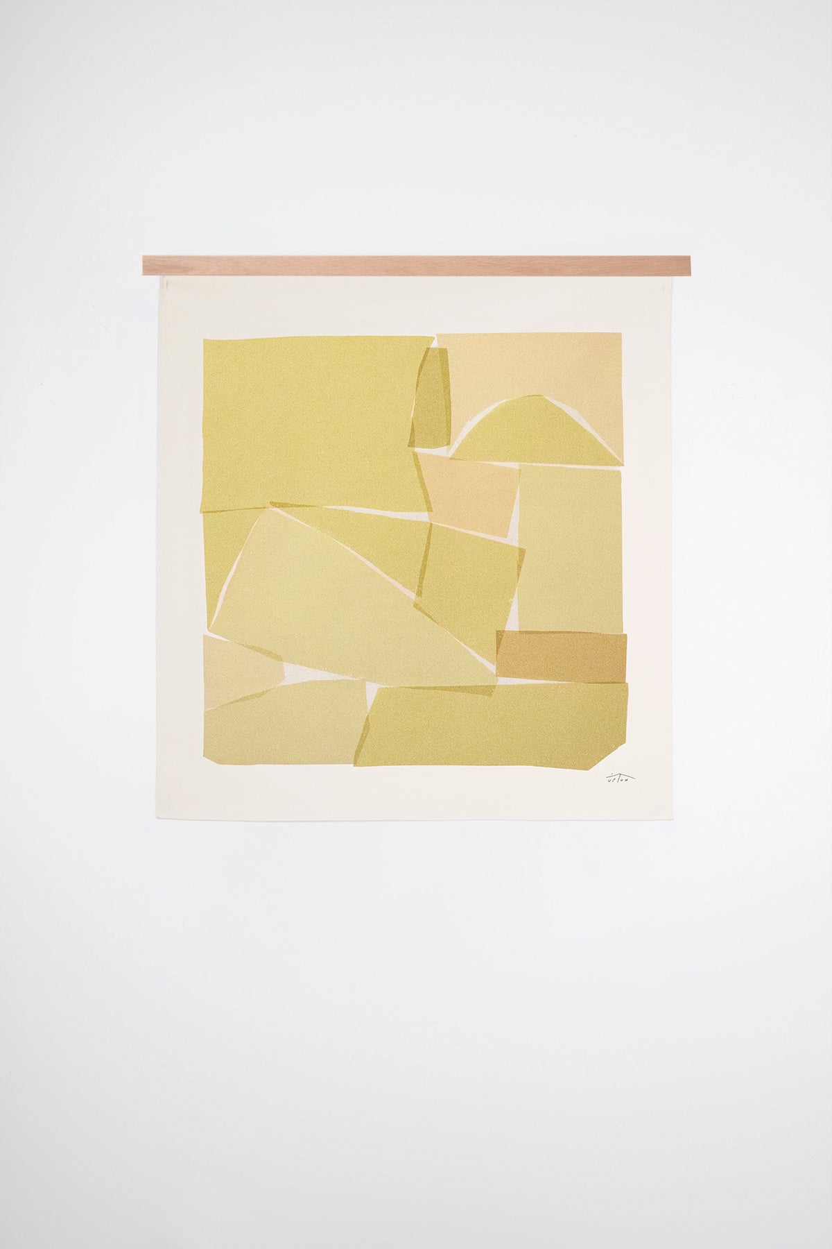 The Ashlar is an original art print on 100% cotton canvas from Michael Upton. Featuring an abstract block print composition in warm yellow hues, the Ashlar is a large format modern wall hanging. Shown here with a wood hanging bar on a white background.