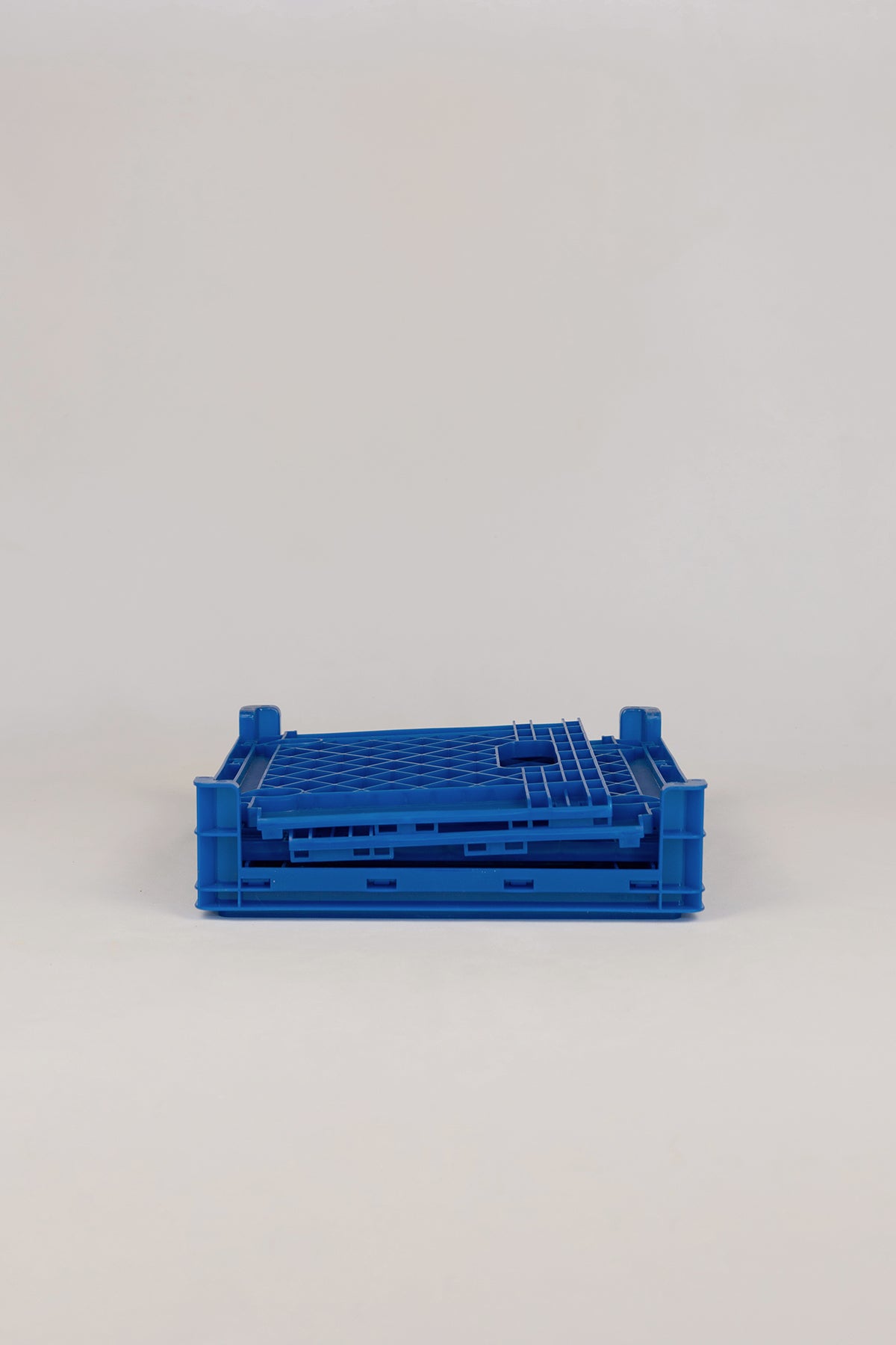 Upton Collapsible Record Crate in royal. Blue plastic crate on a white background