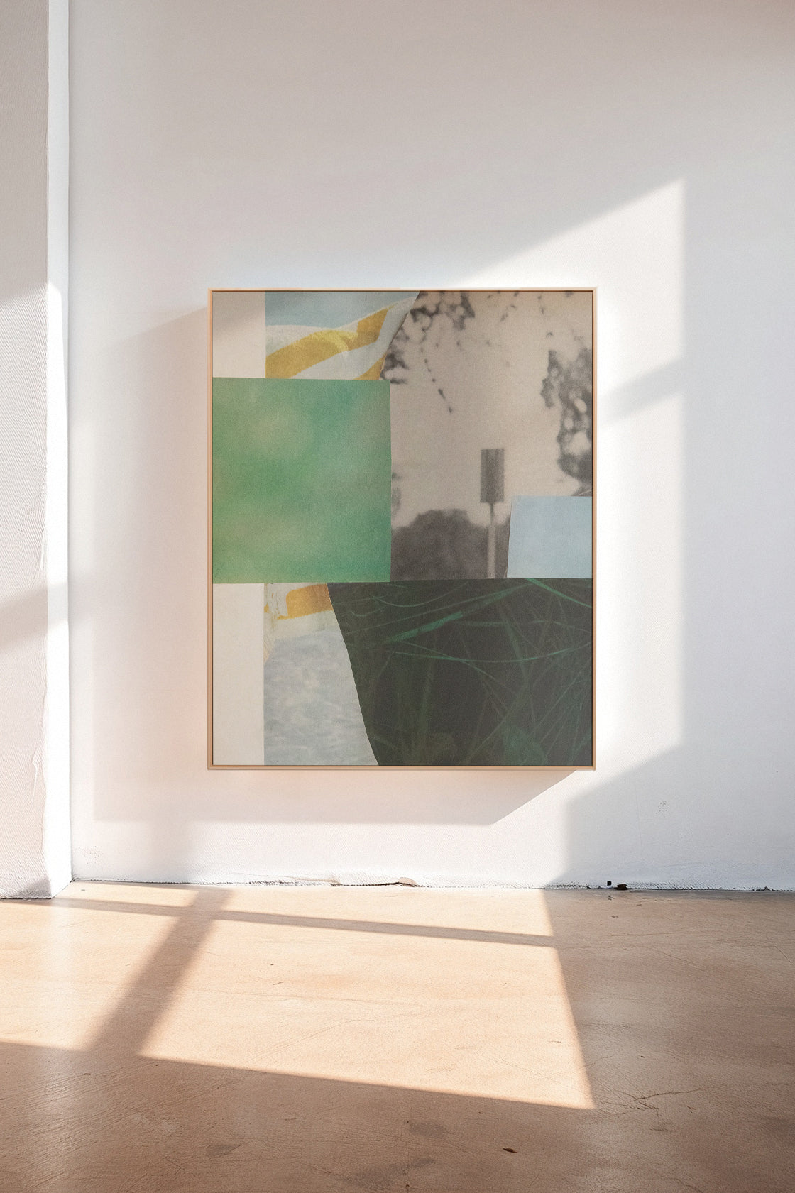 Durrow, a custom framed art print on 100% cotton canvas. Large geometric abstract collage with vivd greens and light blues in a gallery setting.
