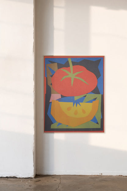 Harvest by Sunroom Studios x Upton, a custom framed art print on 100% cotton canvas. Large cut paper collage of abstract stylized fruit harvest in bright colors and bold geometric shapes, shown in a gallery setting with concrete floors and natural light.