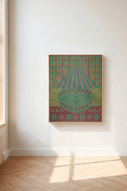 Lamplight by Sunroom Studios x Upton, a custom framed art print on 100% cotton canvas. Large cut paper collage featuring a stylized lamp in muted greens, pinks, reds, starbursts, and floral patterns. Originally created as a risograph print. Shown in a gallery setting with wood floors and natural light.