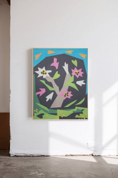 Magnolia in Bloom by Sunroom Studios x Upton, a custom framed art print on 100% cotton canvas. Large cut paper collage featuring a flowering magnolia tree in bold geometric shapes and bright colors. Originally created as a risograph print. Shown in a gallery setting with concrete floors and natural light.