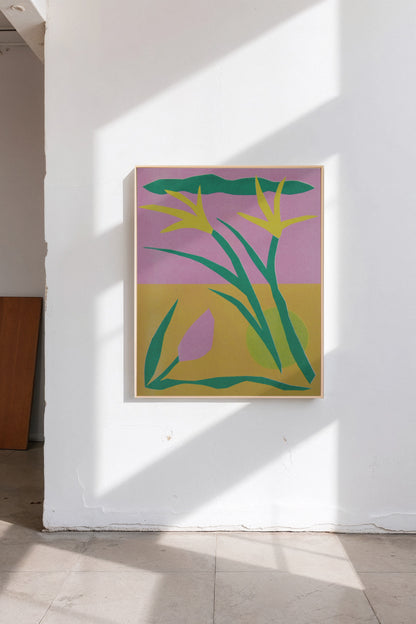 Spring Clippings by Sunroom Studios x Upton, a custom framed art print on 100% cotton canvas. Large cut paper collage featuring abstract stylized flowers in bold greens, yellows, and pinks. Originally created as a risograph print. Shown in a gallery setting with concrete floors and natural light.
